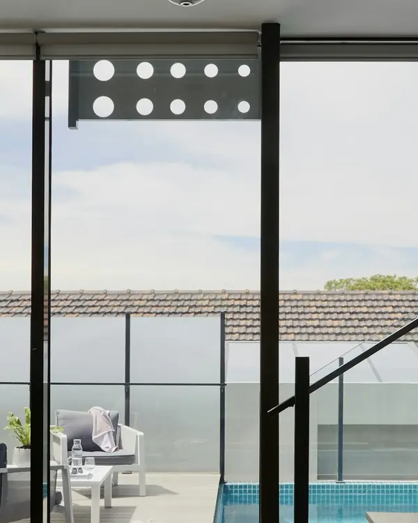 Floor-to-ceiling glazing with slim black frames